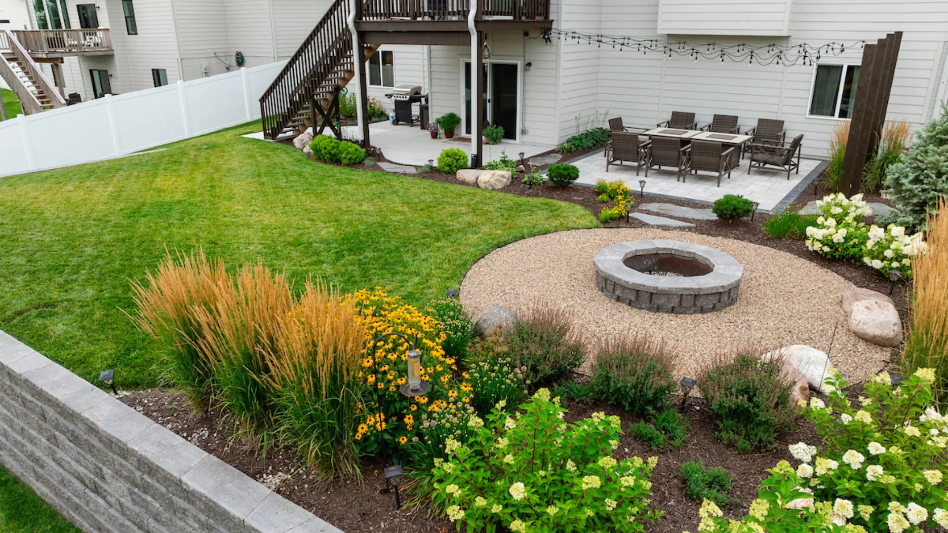 Gretna Home Makeover With Retaining Wall, Fire Pit, Patio & More