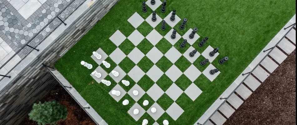 Chess board created with artificial turf on a property in Omaha, NE.