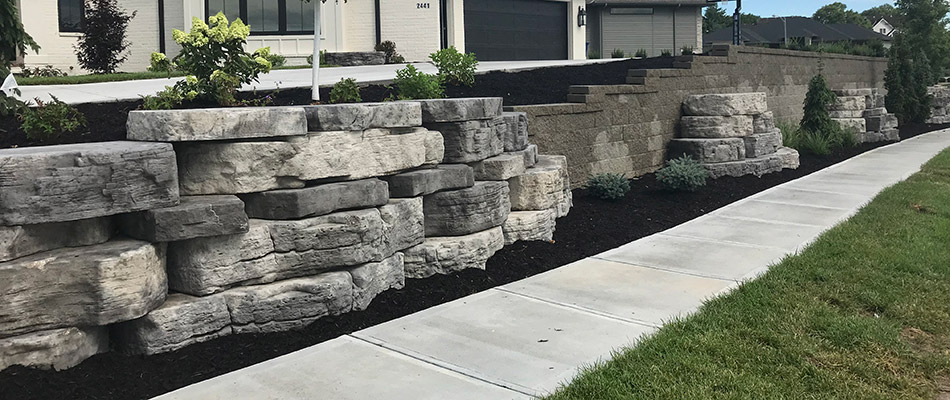 A retaining wall built out of large slabs of stone in Omaha, NE. 
