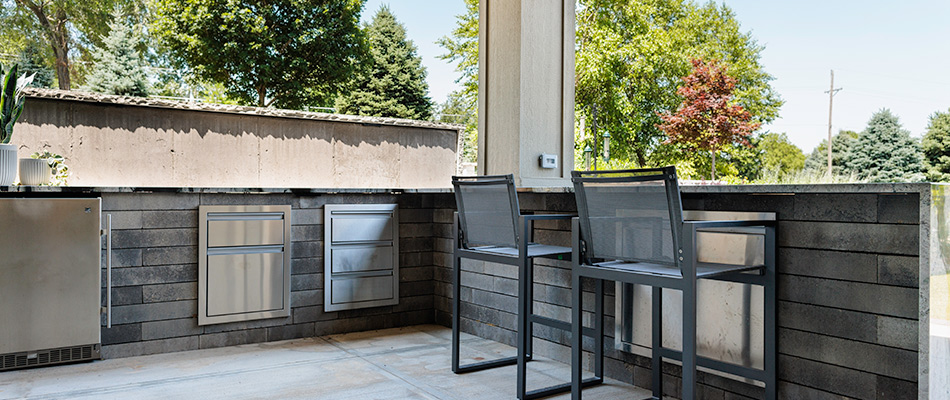 Outdoor kitchen installed with seating available in Omaha, NE.