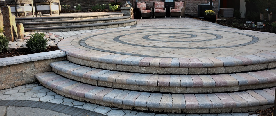 Patio with paver design and matching steps in Omaha, NE.