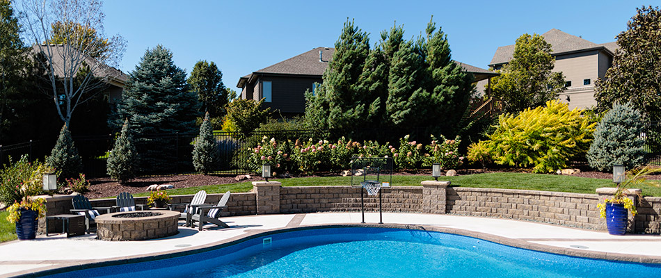 Pool, firepit and landscaping installed for backyard in Omaha, NE.