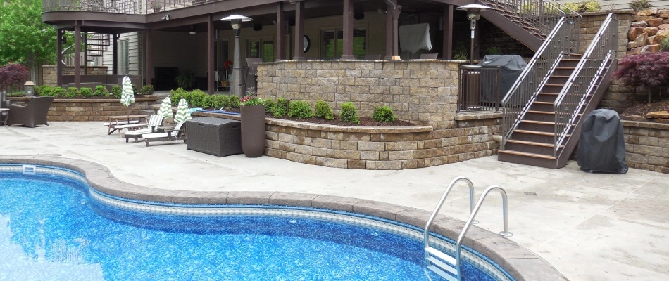Backyard filled with new pool and landscape beds installed in Papillion, NE.