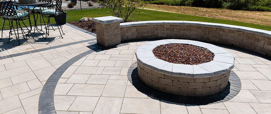 Seating wall and matching fire pit installed for patio in Ashland, NE.