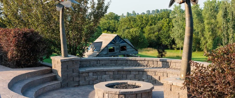 A seating wall installed for both beauty and functionality around a fire pit in Bellevue, NE.