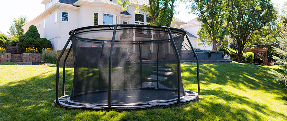 In ground trampoline added to lawn in Omaha, NE.